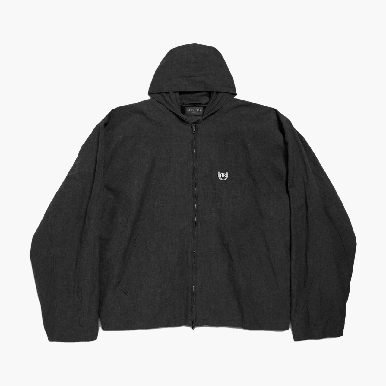 Veste à capuche Balenciaga noire présentée à plat de face, fermeture zippée et poches latérales, photo produit Lesthete Concept Store.